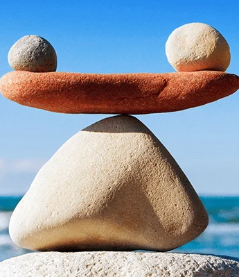 Rocks balanced on a platform as a metaphor showing perfect balance when pricing.